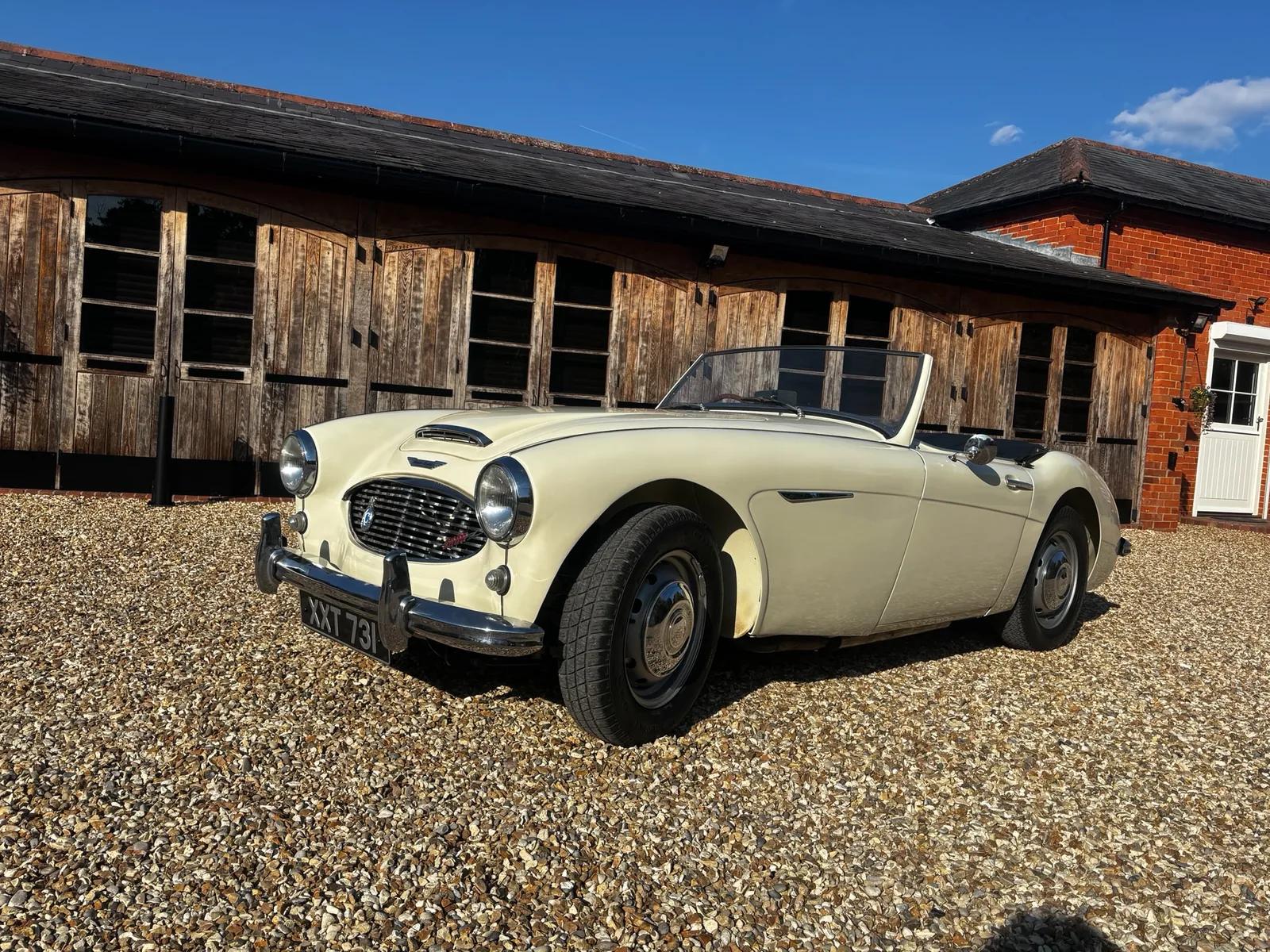 Cream classic British roadster at Welch Automotive